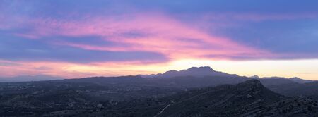 Sunset in the mountains of Elche province of Alicante in Spain. Panoramic horizontal shotの写真素材
