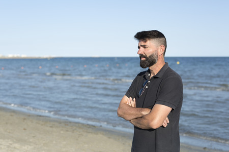 Pensive man on a beach. Take place in Santa Pola province of Alicante, Spain.の写真素材