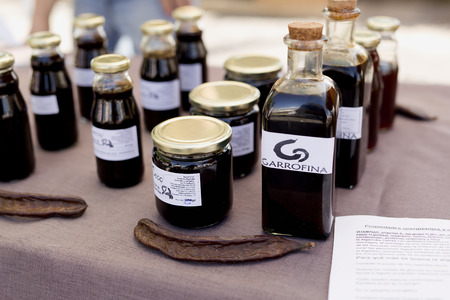 Altea, Spain. October 15, 2017:  sweet carob tree selling in a market in Altea, Alicante province in Spain.のeditorial素材