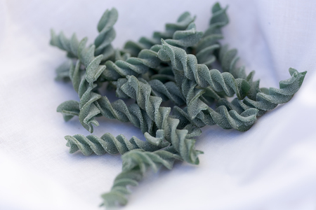 Uncooked organic fresh pasta on a light background. Horizontal shot with natural light.の写真素材