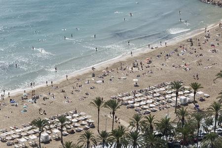 Alicante, Spain October 19, 2017: People bathing in Postiguet beach in Autumn at 25 degrees.のeditorial素材