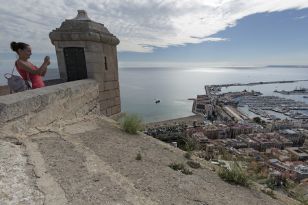 Alicante, Spain October 19, 2017: Tourist taking pictures of the city of Alicante from the Castle of Santa Barbara.のeditorial素材