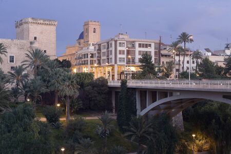 Views of the city of Elche dusk. In the image are the Altamira Palace, the Basilica of Santa Maria and the Altamira bridge.のeditorial素材