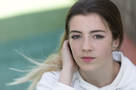 A teenager looking at camera to take some photos. Horizontal shot with natural light.の写真素材