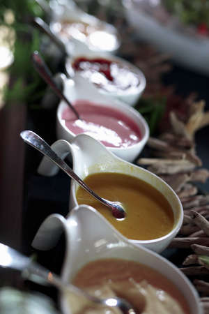 Assorted sauces to accompany Belgian food. Volume made inside a restaurant with ambient light.の写真素材