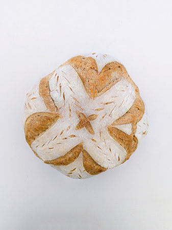 Handmade sourdough bread with symmetrical drawing. Horizontal shot with natural light.の写真素材