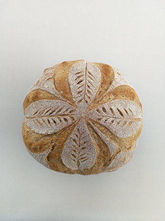 Handmade sourdough bread with symmetrical drawing. Horizontal shot with natural light.の写真素材