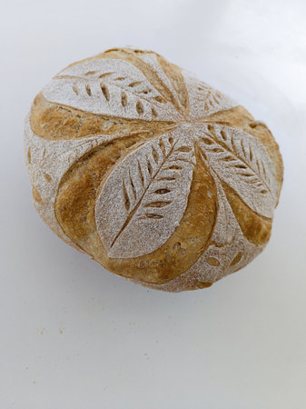 Handmade sourdough bread with symmetrical drawing. Horizontal shot with natural light.の写真素材