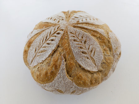 Handmade sourdough bread with symmetrical drawing. Horizontal shot with natural light.の写真素材