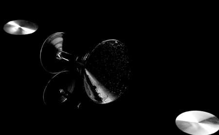 Cup on black background with flashes of lightの写真素材