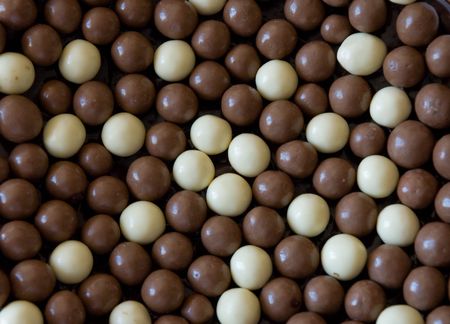 Chocolate cake cover with brown and white chocolate balls