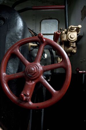 Steering wheel of an old steam locomotiveの写真素材
