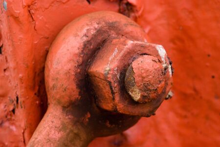 Macro on a red rusty nautical mechanismの写真素材