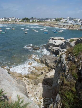 Coastal village and harbor taken from the cliffsの写真素材