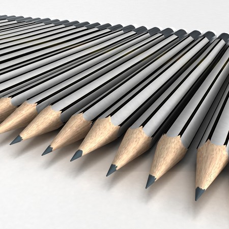 Grey pencils neatly arranged in a white surfaceの写真素材