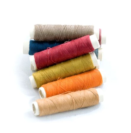 Multicolored bobbins of sewing cotton threadsの写真素材