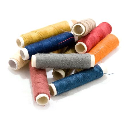 Multicolored bobbins of sewing cotton threadsの写真素材