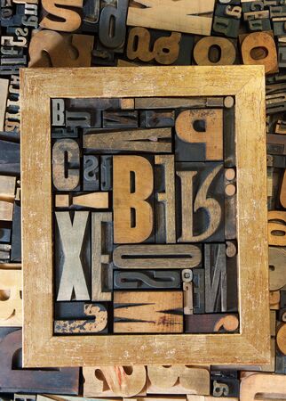 Background of vintage wooden print letter cases with a frameの写真素材
