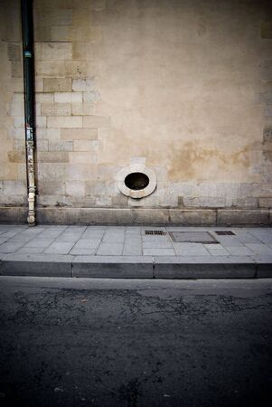 Picture of a picturesque Parisian wall with a porthole windowの写真素材