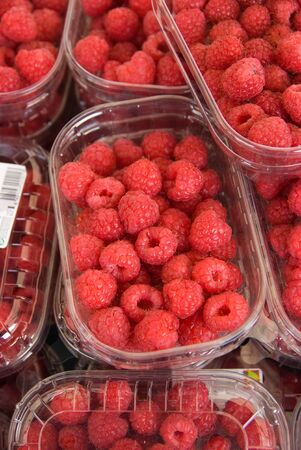 Raspberry trays in a market stall