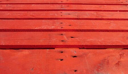 Wooden boards painted in red, ideal of backgrounds and textures