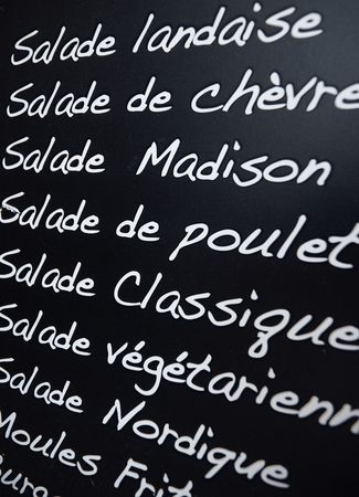 Close up shot of a menu in French written with chalk in a blackboardの写真素材