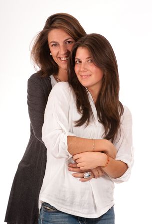 
Isolated image of a mother and teenager daughter in a happy embrace 
の写真素材