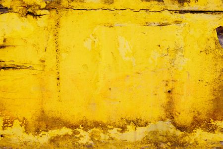 Dirty grunge yellow surface ideal for backgrounds and textureの写真素材