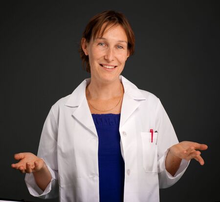 Woman with a medical uniform and a friendly smileの写真素材