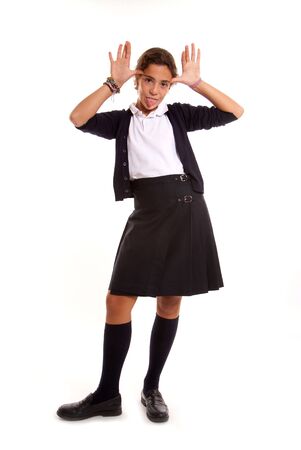 Schoolgirl in uniform in a mocking gestureの写真素材