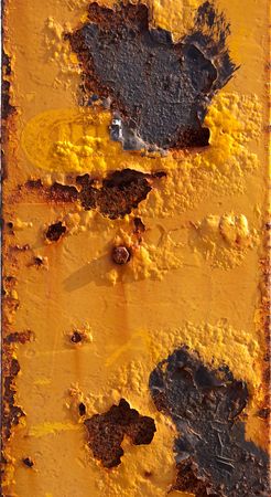 Rusty metal surface painted in yellow の写真素材