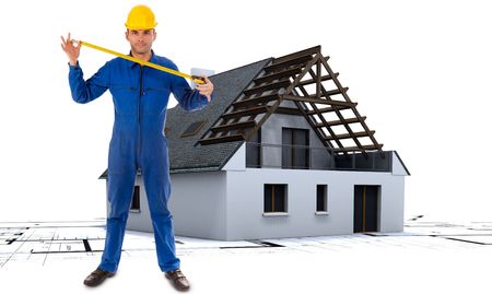 
Worker extending a tape measure with a house in construction and architecture plans in the background
の写真素材