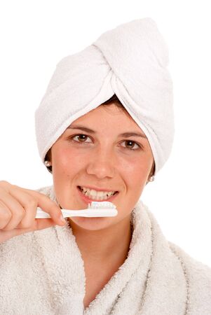 
Isolated image of a cute girl with a towel around her head brushing her teeth
の写真素材