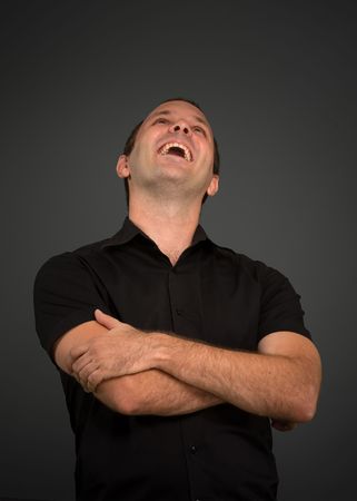 
Portrait of a laughing man in a black shirt 
の写真素材