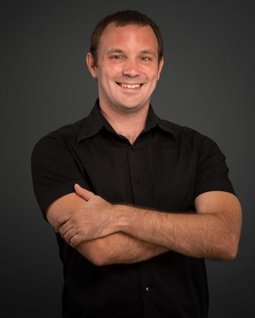 
Portrait of a smiling man in a black shirt 
の写真素材