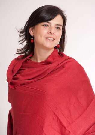 
Pretty brunette wrapped in a cashmere red shawl
の写真素材