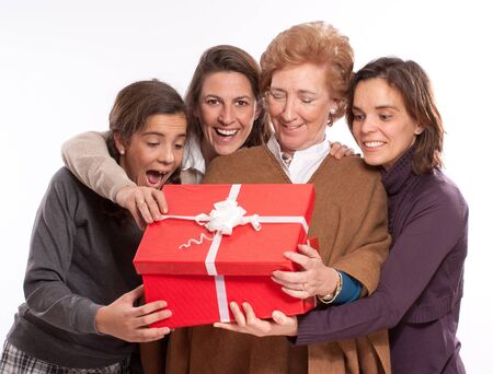 Family women in raptures over an open giftbox