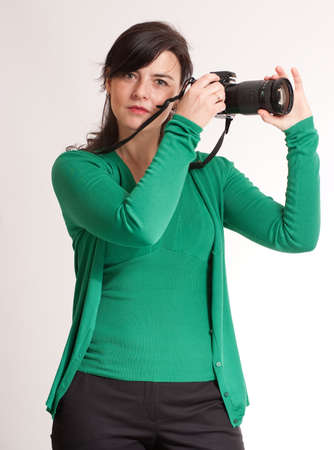 
Portrait of an attractive brunette holding a photographic camera
の写真素材