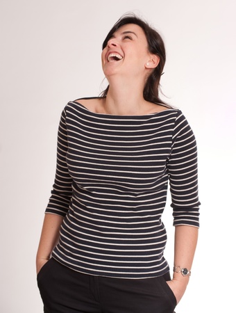 
Portrait of an attractive laughing brunette wearing a stripped t-shirt
の写真素材