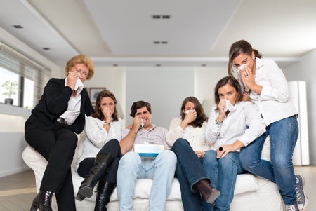 

A group of family members sitting at home crying watching tv

の写真素材