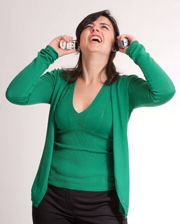 
Hysterical brunette talking with two telephone receivers
の写真素材