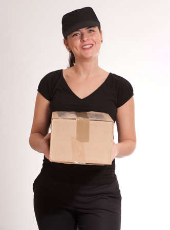 
Portrait of a delivery girl in black carrying a parcel
の写真素材