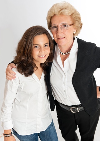 
Girl and grandmother posing against a white background

の写真素材