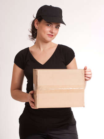 
Portrait of a delivery girl in black carrying a parcel
の写真素材