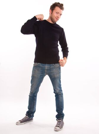 
Portrait of a young man casually dressed boasting of muscles
の写真素材