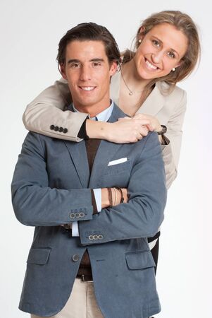 

Young adult couple embracing against a white background
の写真素材