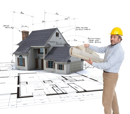 
Architect holding  plans with a House mock-up on top of blueprints with pen notes and corrections
の写真素材