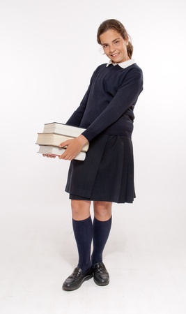 
Schoolgirl carrying three heavy books
の写真素材