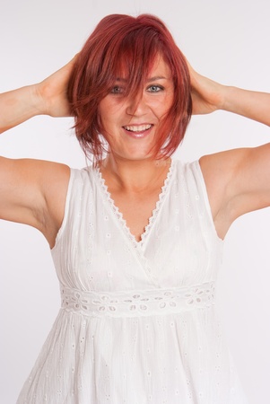 
Red haired woman with a happily surprised expression
の写真素材