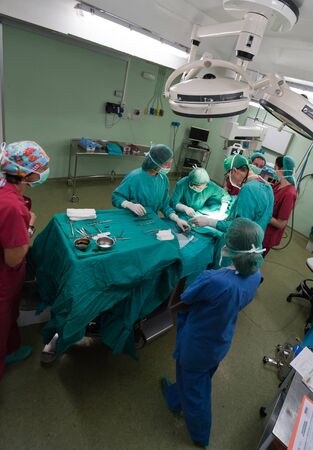 Aerial view of a medical team performing a surgeryの写真素材